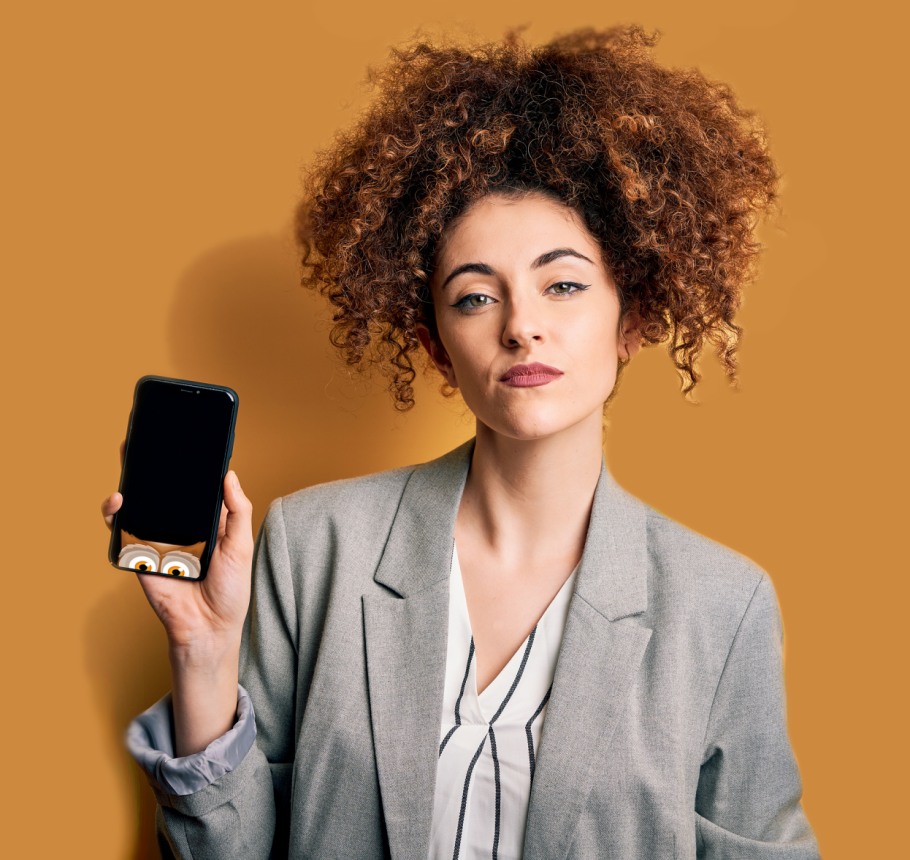 Woman wearing jacket holding a mobile phone with Whoopert the Owl