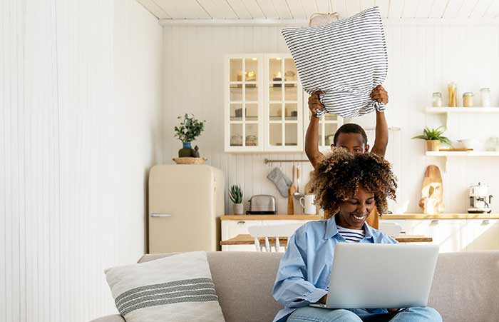 Lady on Couch Using Tablet